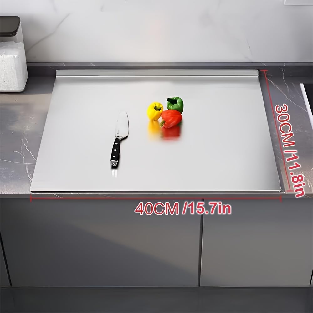 Sumzzz Stainless Steel Cutting Board - size comparison with small objects showing board dimensions
